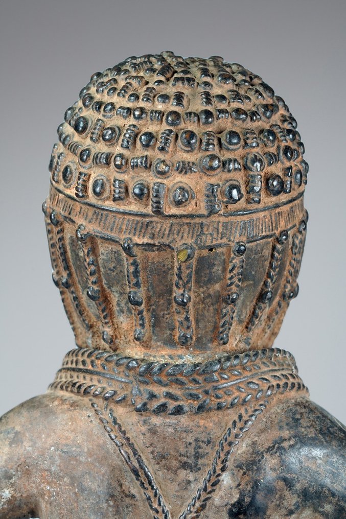 A female Bronze sculpture, in the style of Benin