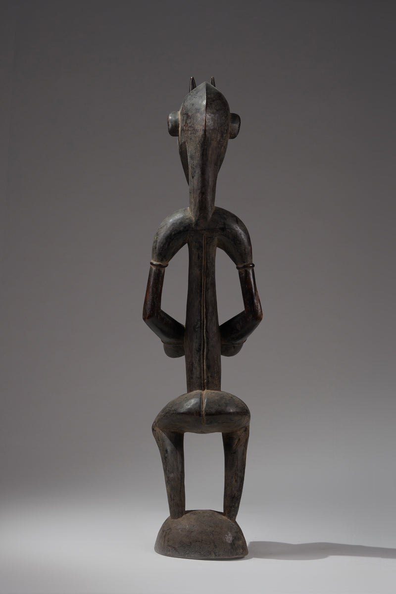 A male guardian figure of the Senufo