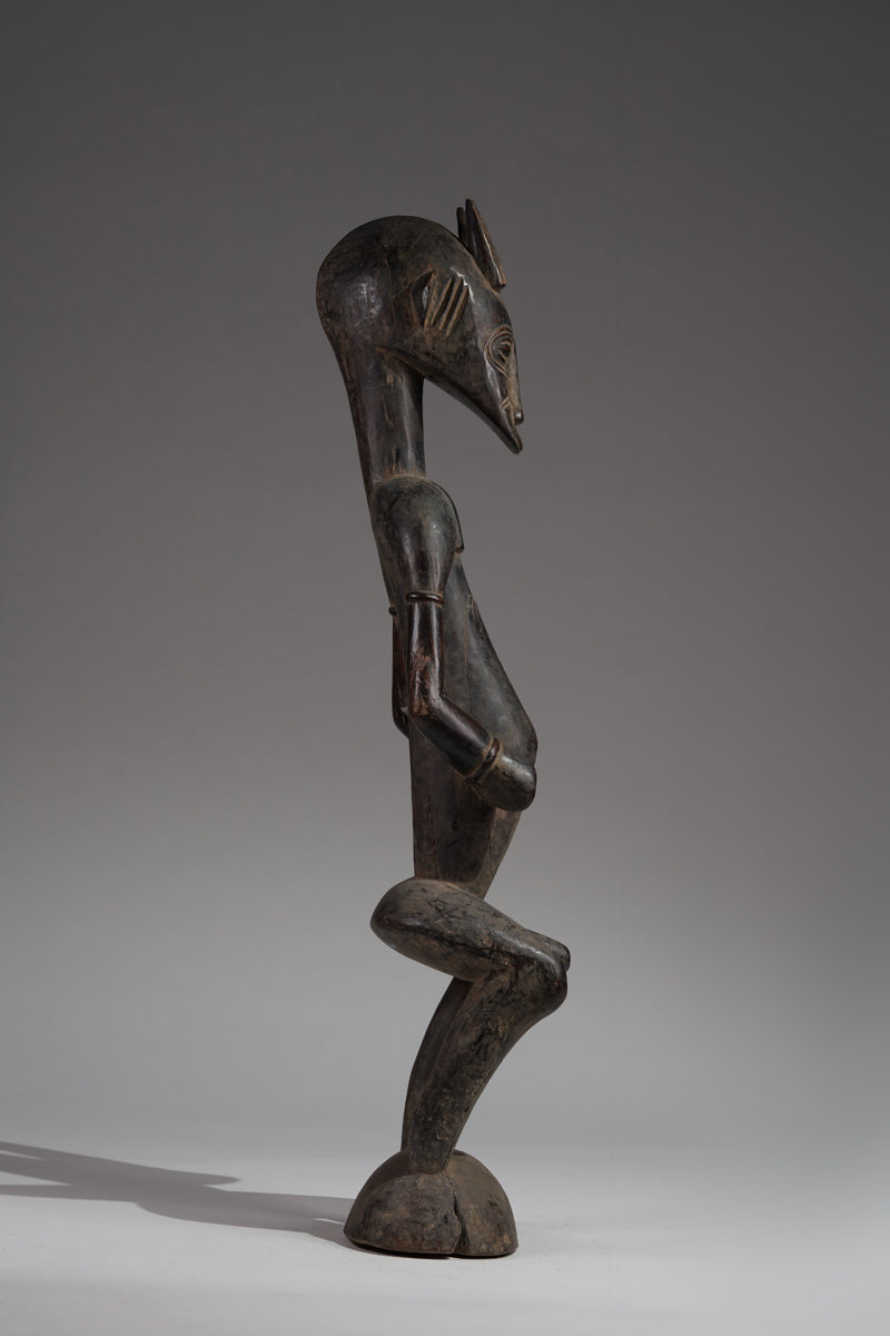 A male guardian figure of the Senufo