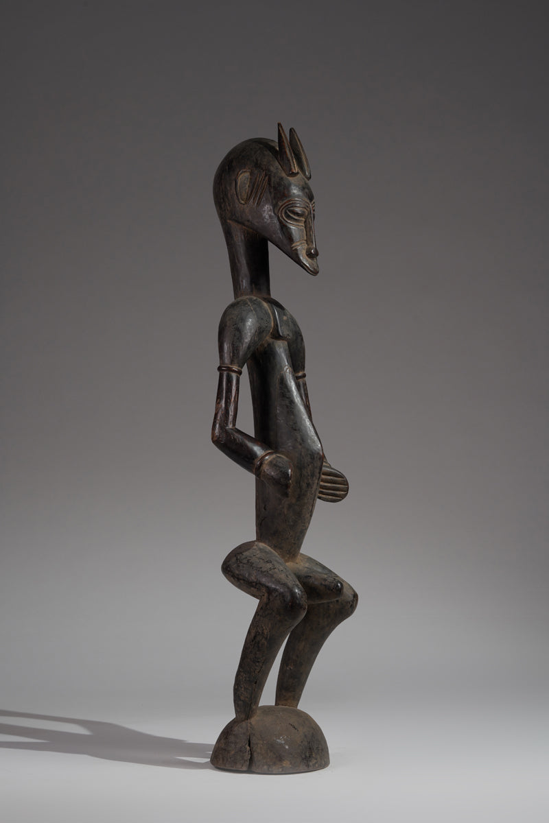 A male guardian figure of the Senufo
