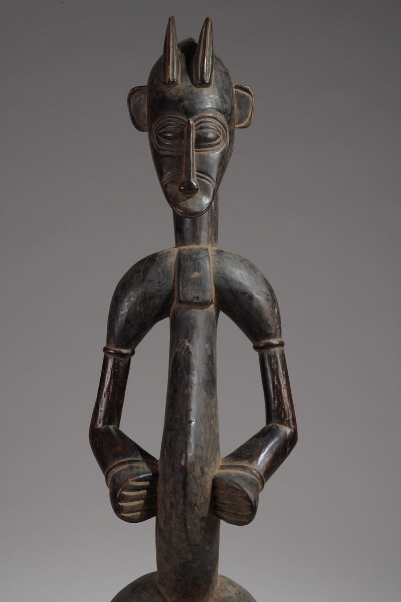 A male guardian figure of the Senufo