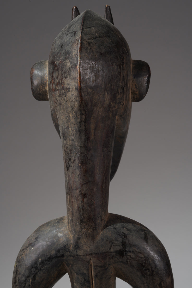 A male guardian figure of the Senufo