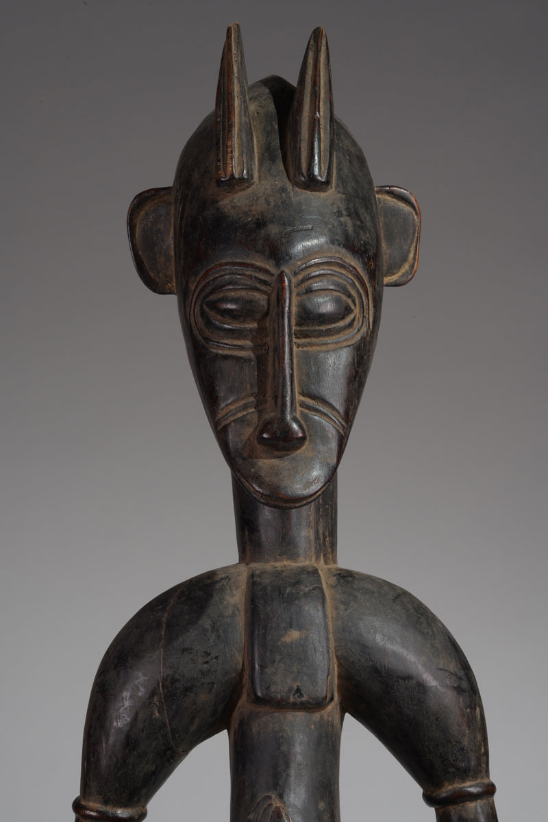 A male guardian figure of the Senufo