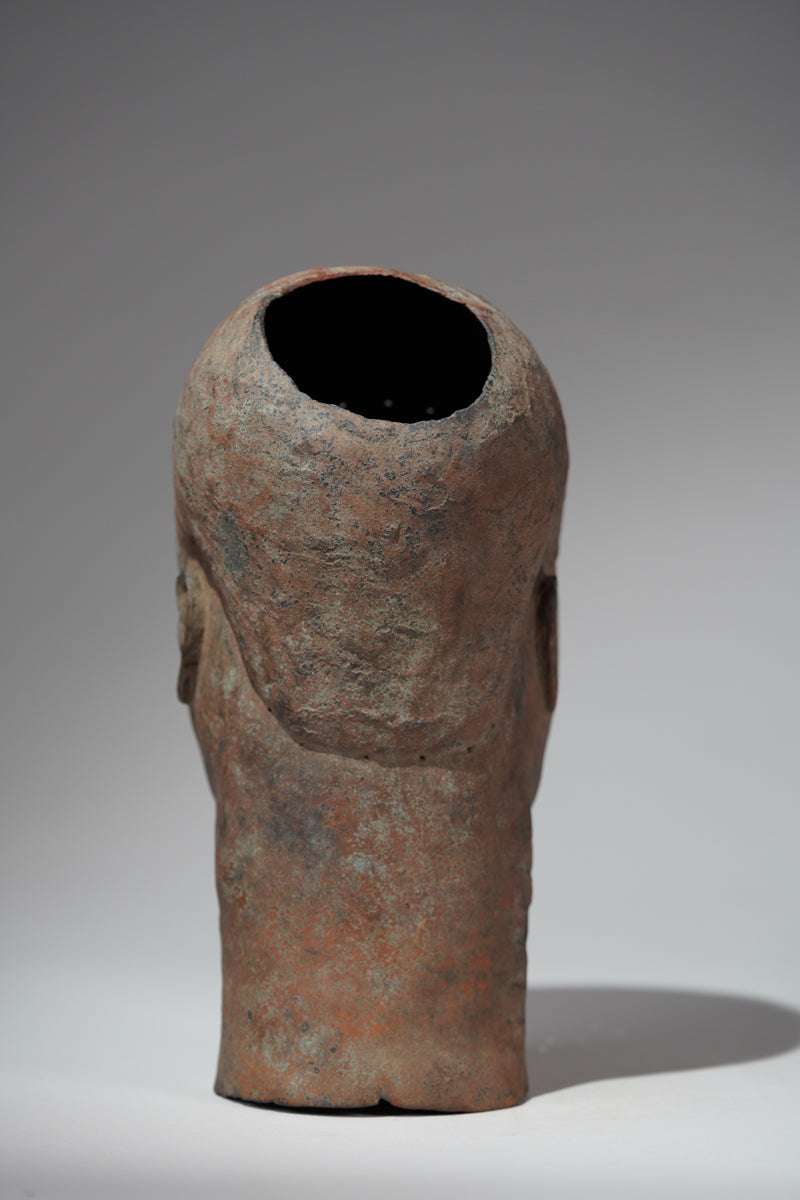 A naturalistic, thinwalled bronze head