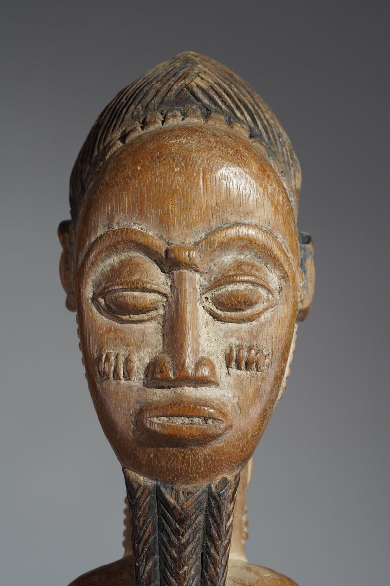 A Baule male sculpture