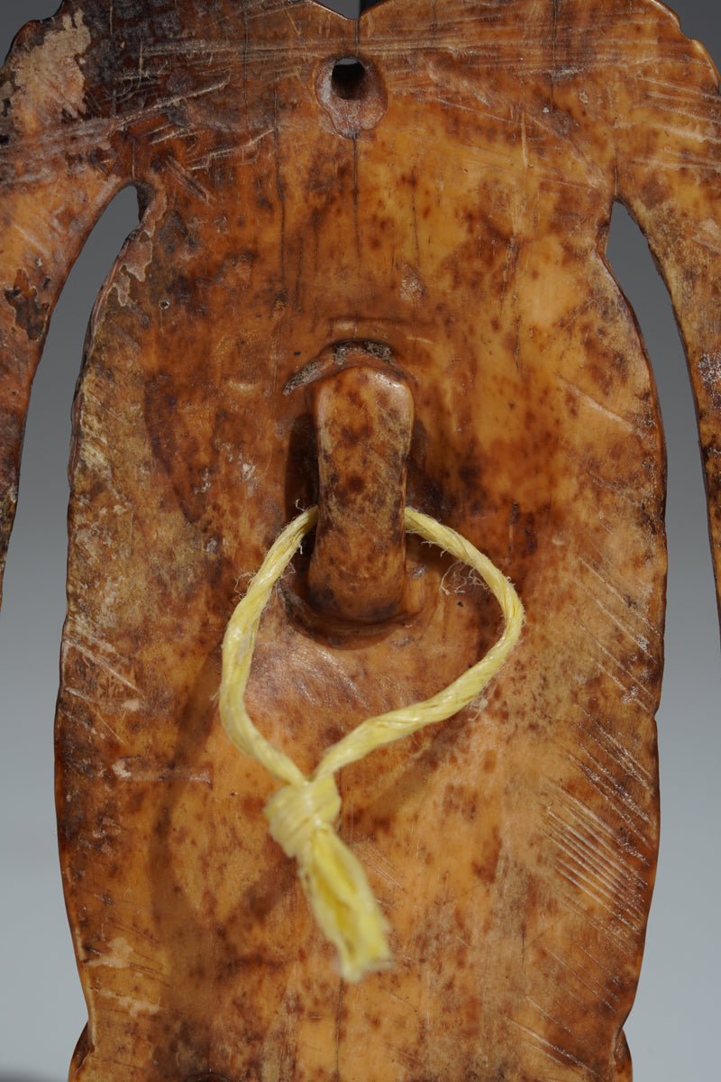 A Benin bone pendant