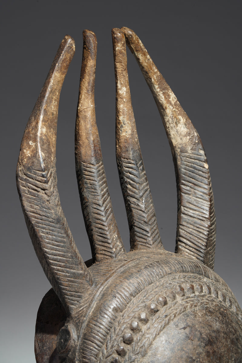 A horned Baule mask