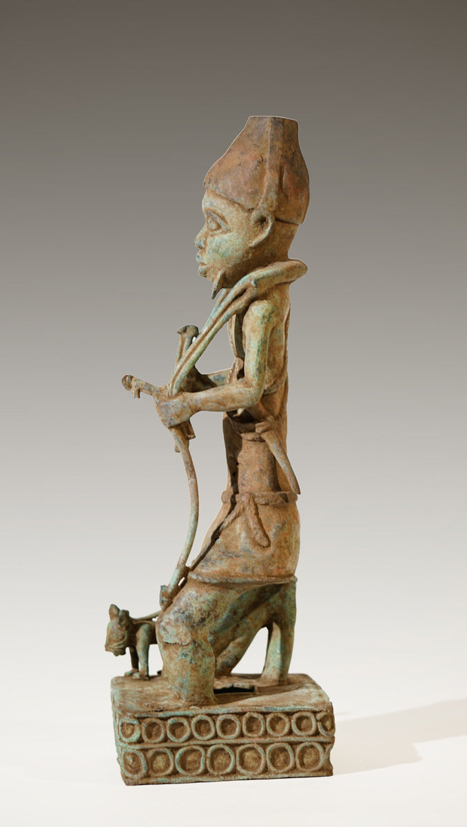 A Benin Bronze of a hunter in Tada style