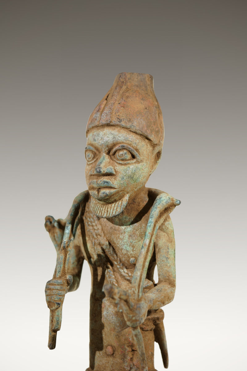 A Benin Bronze of a hunter in Tada style
