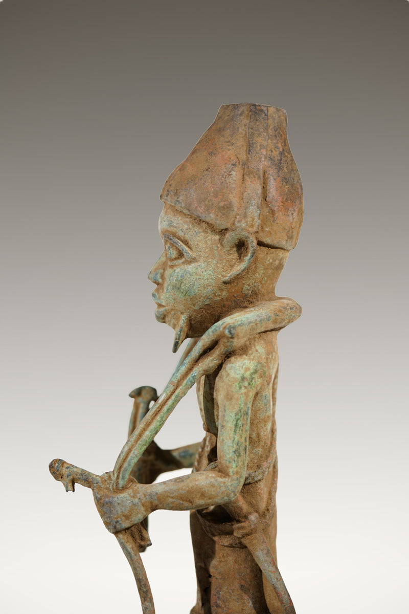 A Benin Bronze of a hunter in Tada style