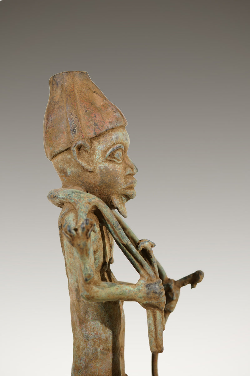 A Benin Bronze of a hunter in Tada style