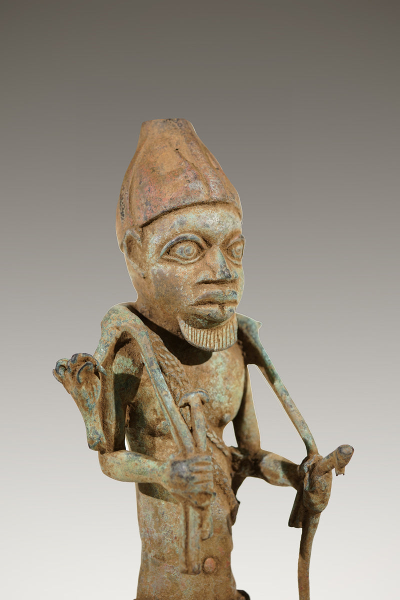 A Benin Bronze of a hunter in Tada style