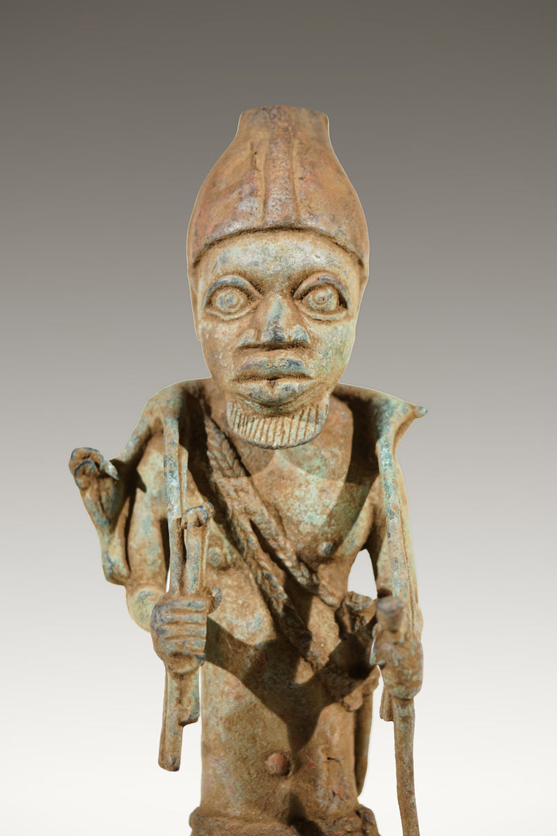 A Benin Bronze of a hunter in Tada style