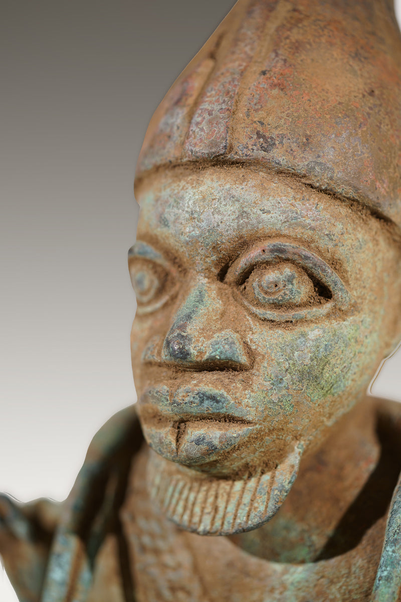 A Benin Bronze of a hunter in Tada style