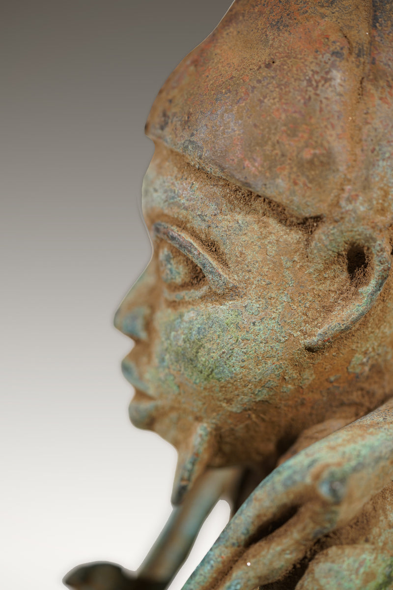 A Benin Bronze of a hunter in Tada style