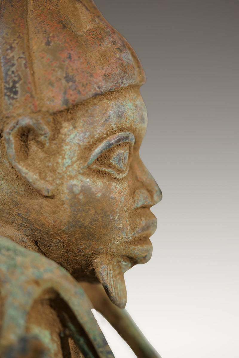 A Benin Bronze of a hunter in Tada style