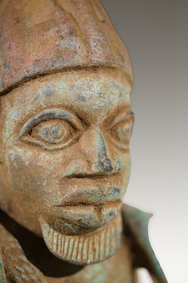 A Benin Bronze of a hunter in Tada style