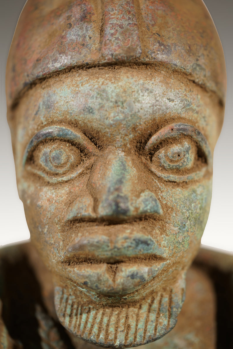 A Benin Bronze of a hunter in Tada style