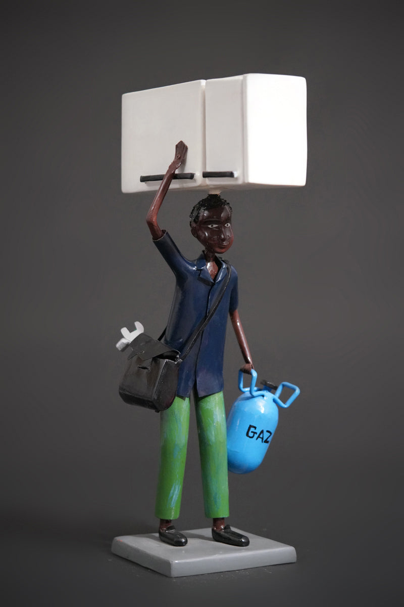 A Mechanic with a Fridge, Tools, and Gas Bottle