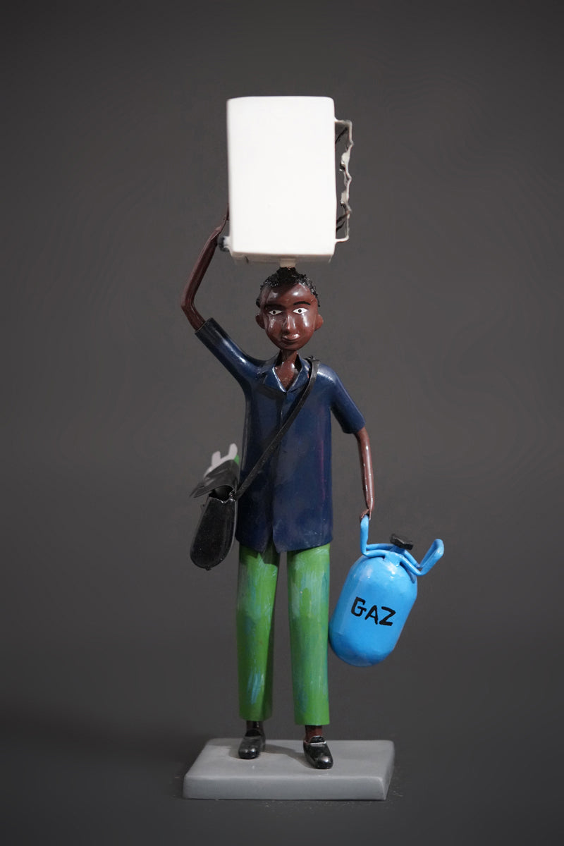 A Mechanic with a Fridge, Tools, and Gas Bottle