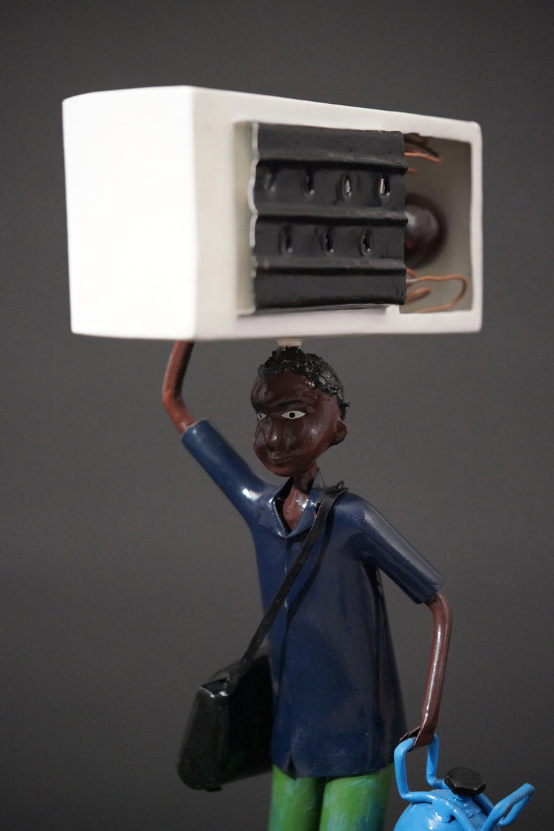 A Mechanic with a Fridge, Tools, and Gas Bottle