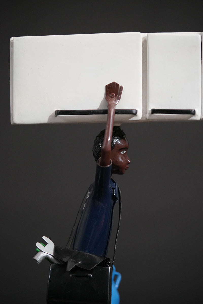 A Mechanic with a Fridge, Tools, and Gas Bottle