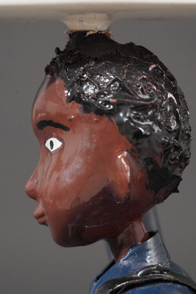 A Mechanic with a Fridge, Tools, and Gas Bottle