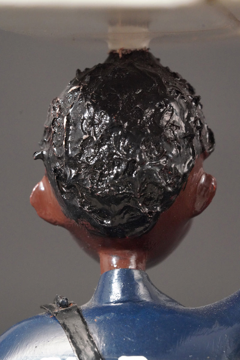 A Mechanic with a Fridge, Tools, and Gas Bottle