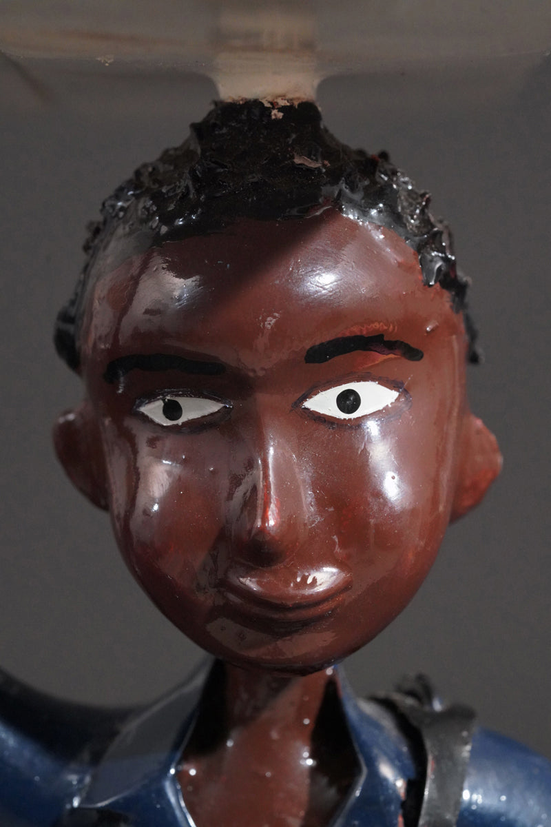 A Mechanic with a Fridge, Tools, and Gas Bottle