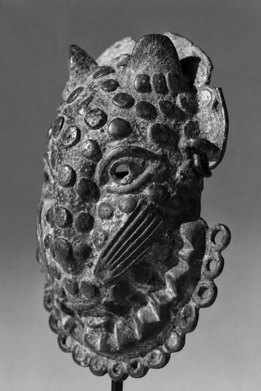 A Benin Bronze hip mask