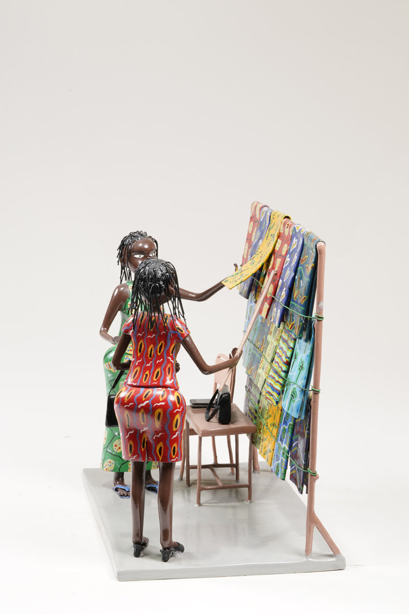 Two women dressed in typical African textiles