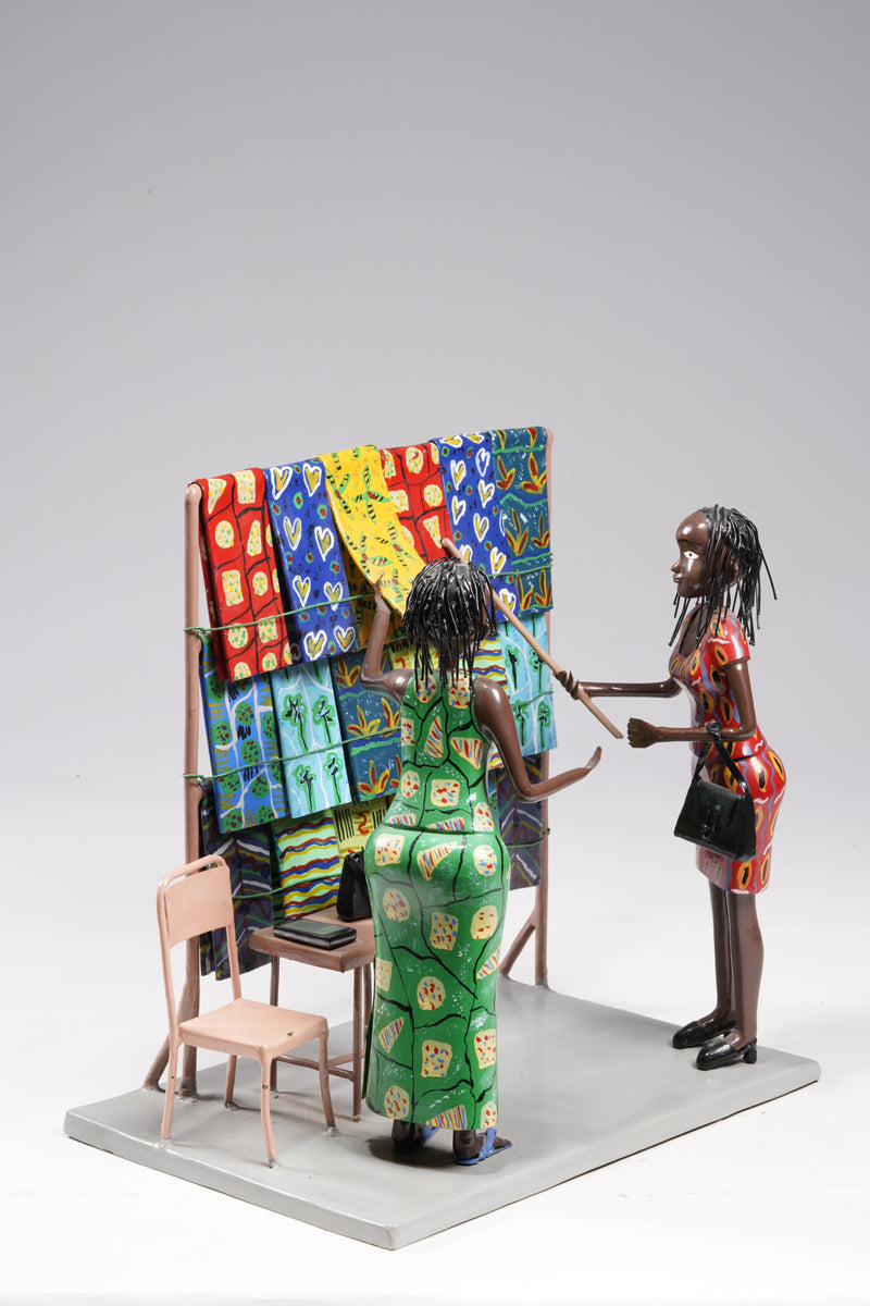Two women dressed in typical African textiles