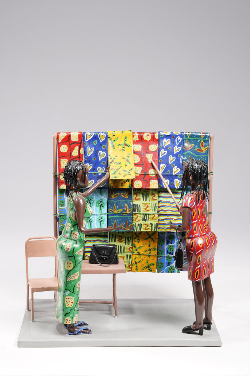 Two women dressed in typical African textiles