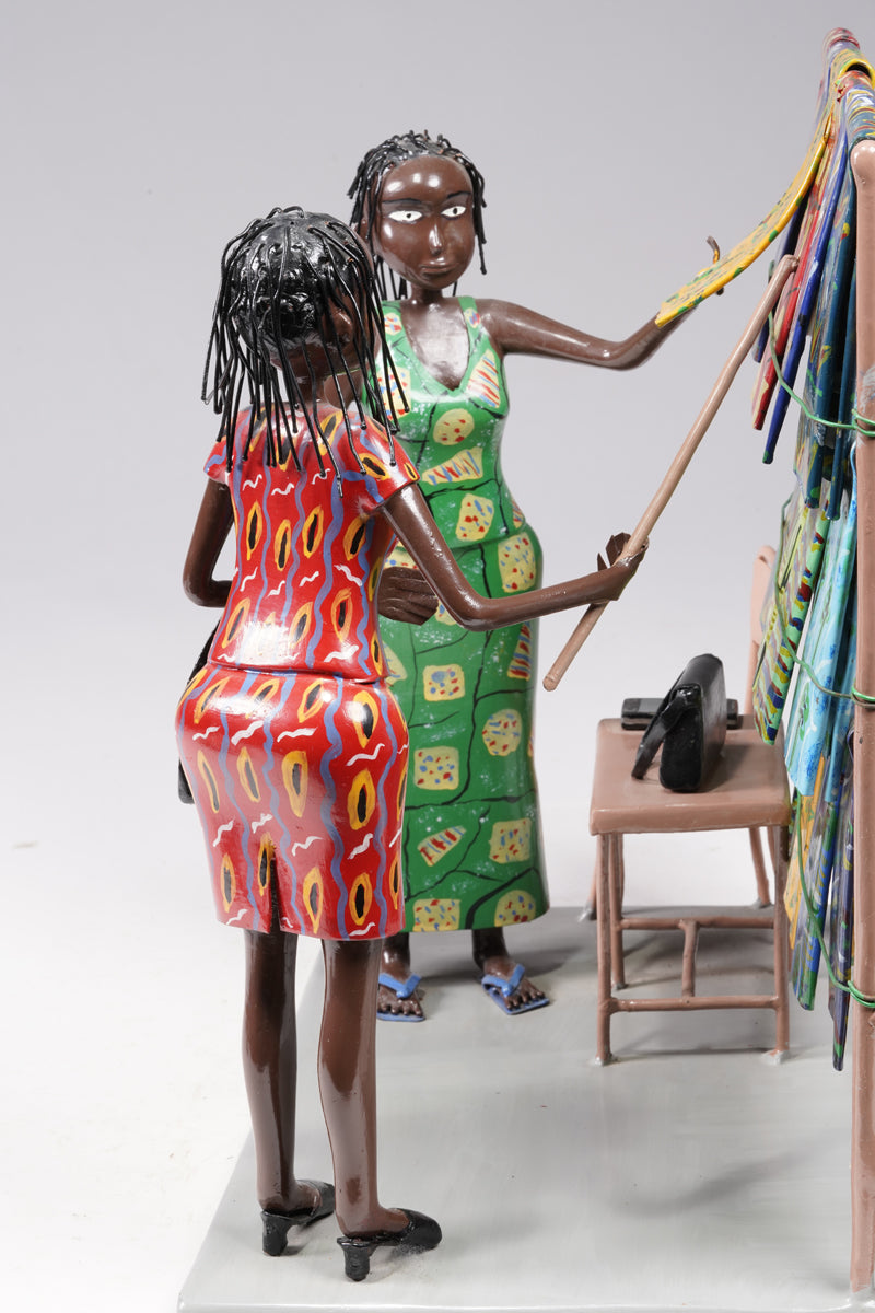 Two women dressed in typical African textiles