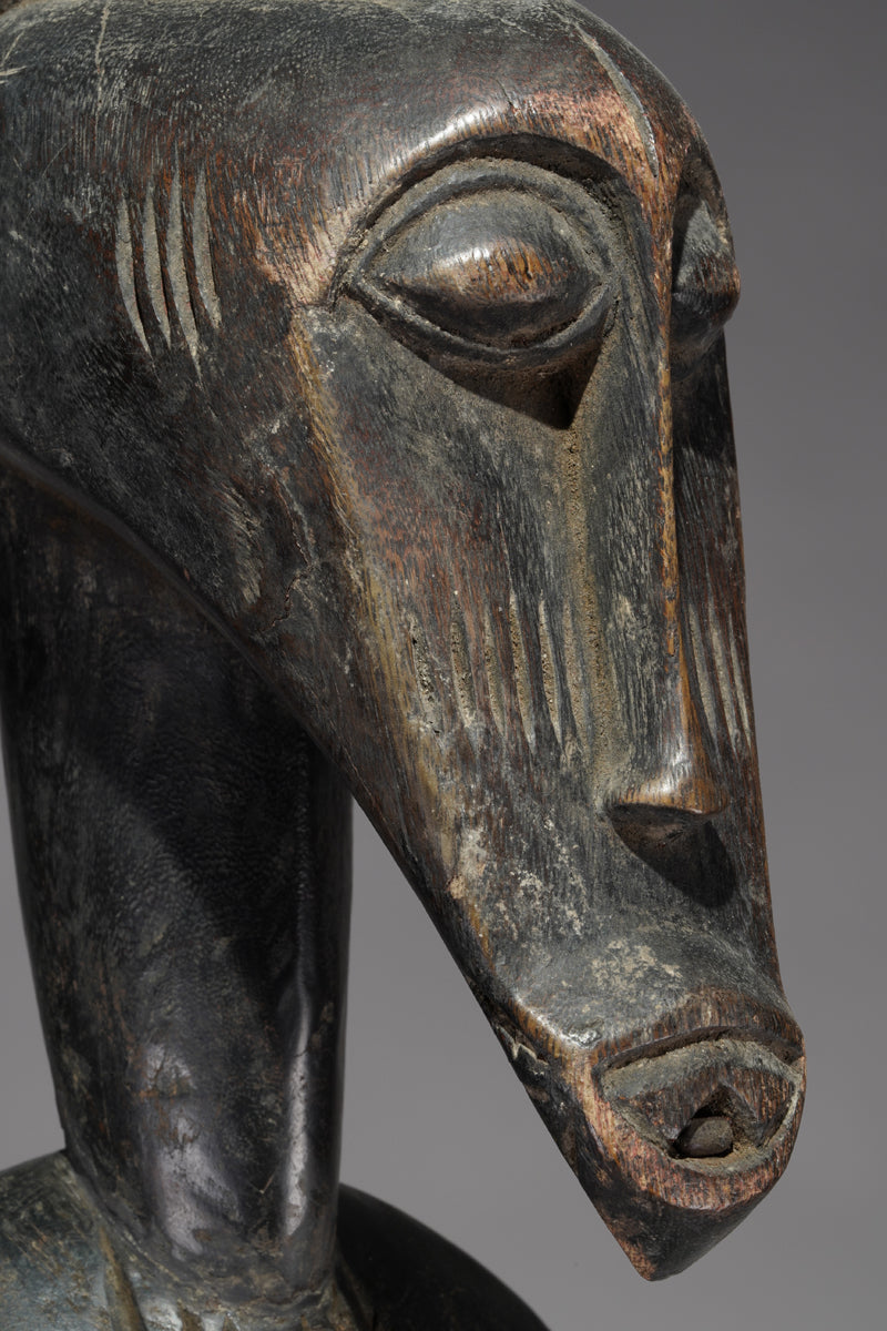 A male Senufo Rhythm Pounder, called Déblé