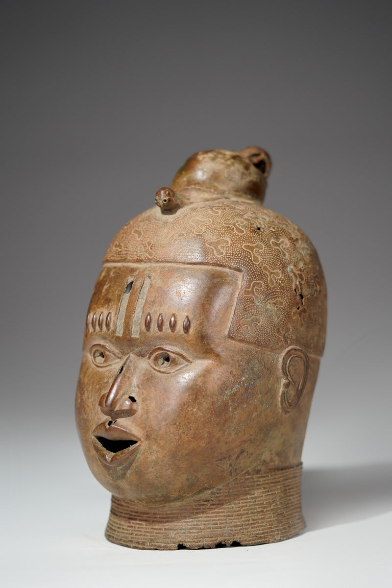 An bronze head in the style of Benin