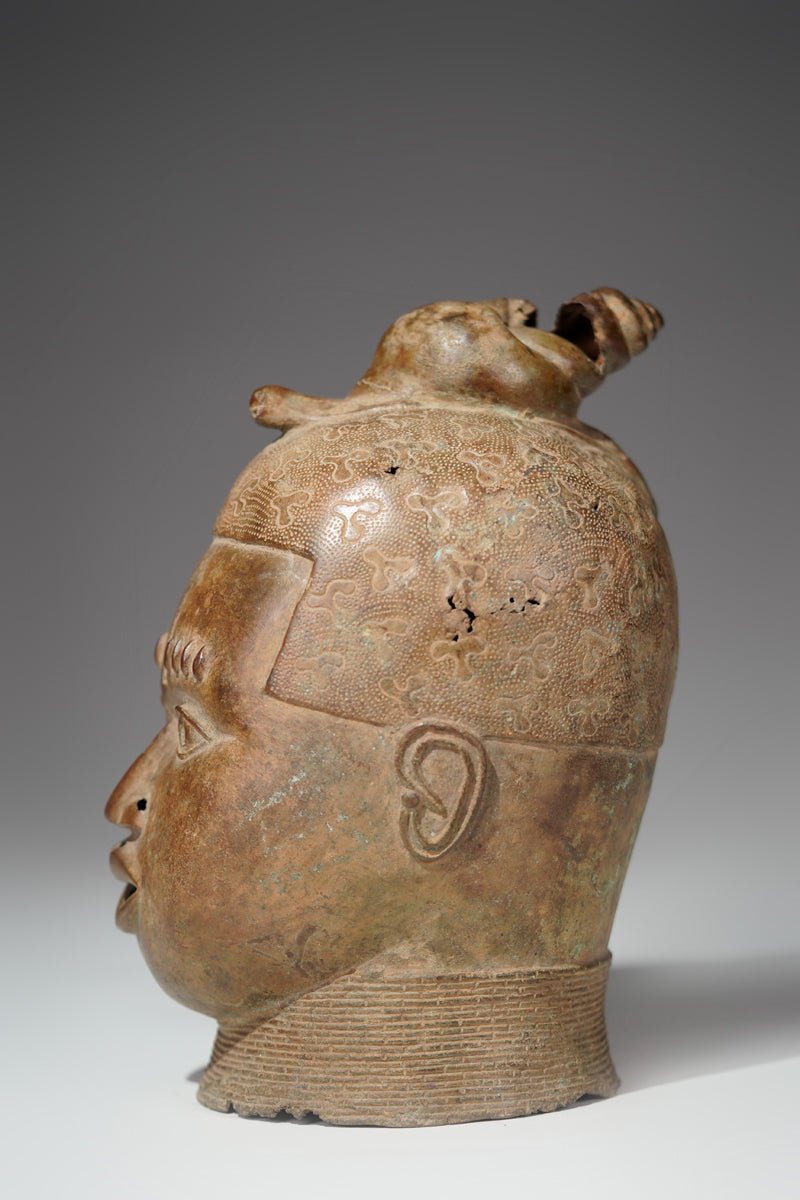 An bronze head in the style of Benin