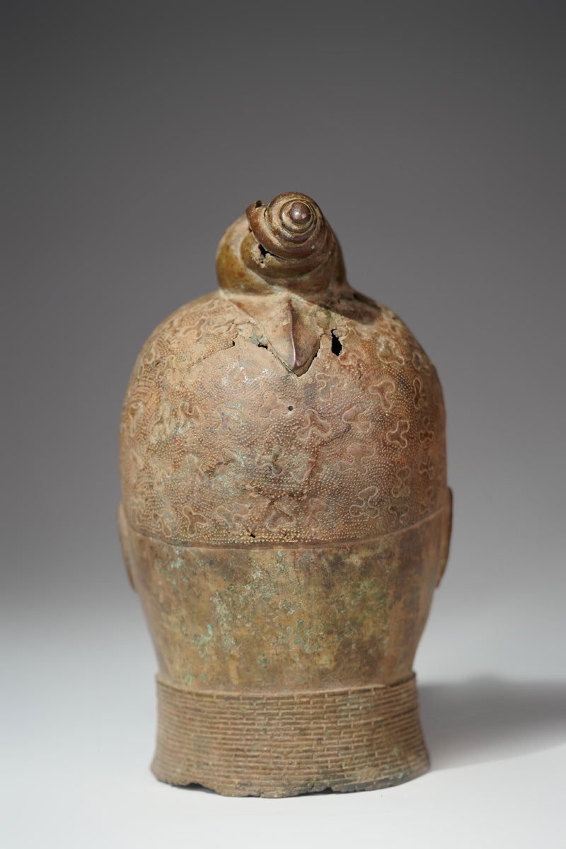 An bronze head in the style of Benin