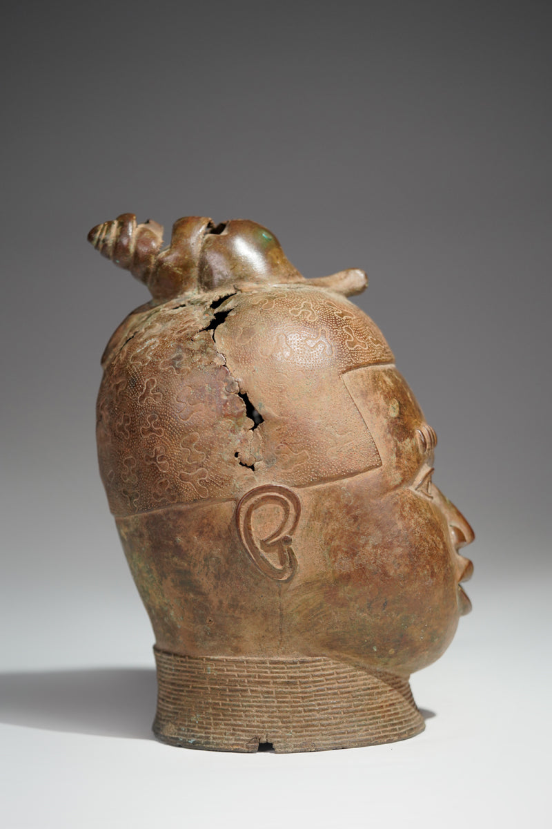 An bronze head in the style of Benin