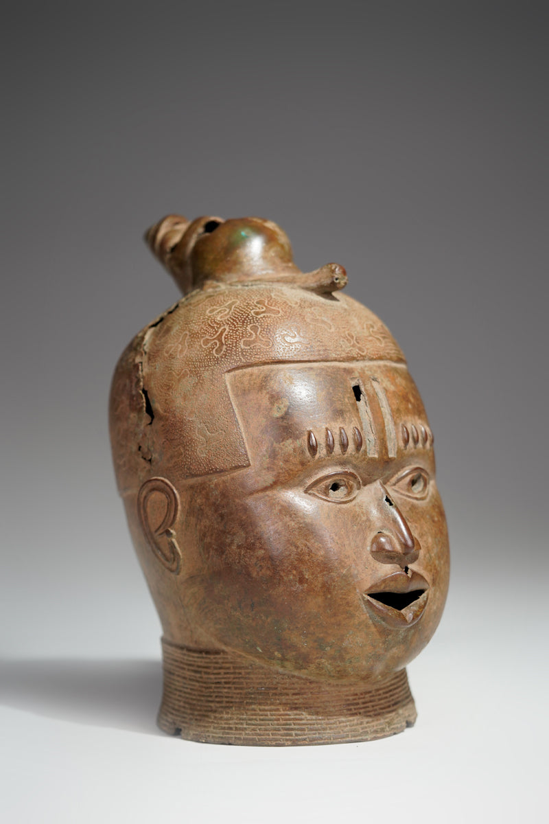 An bronze head in the style of Benin