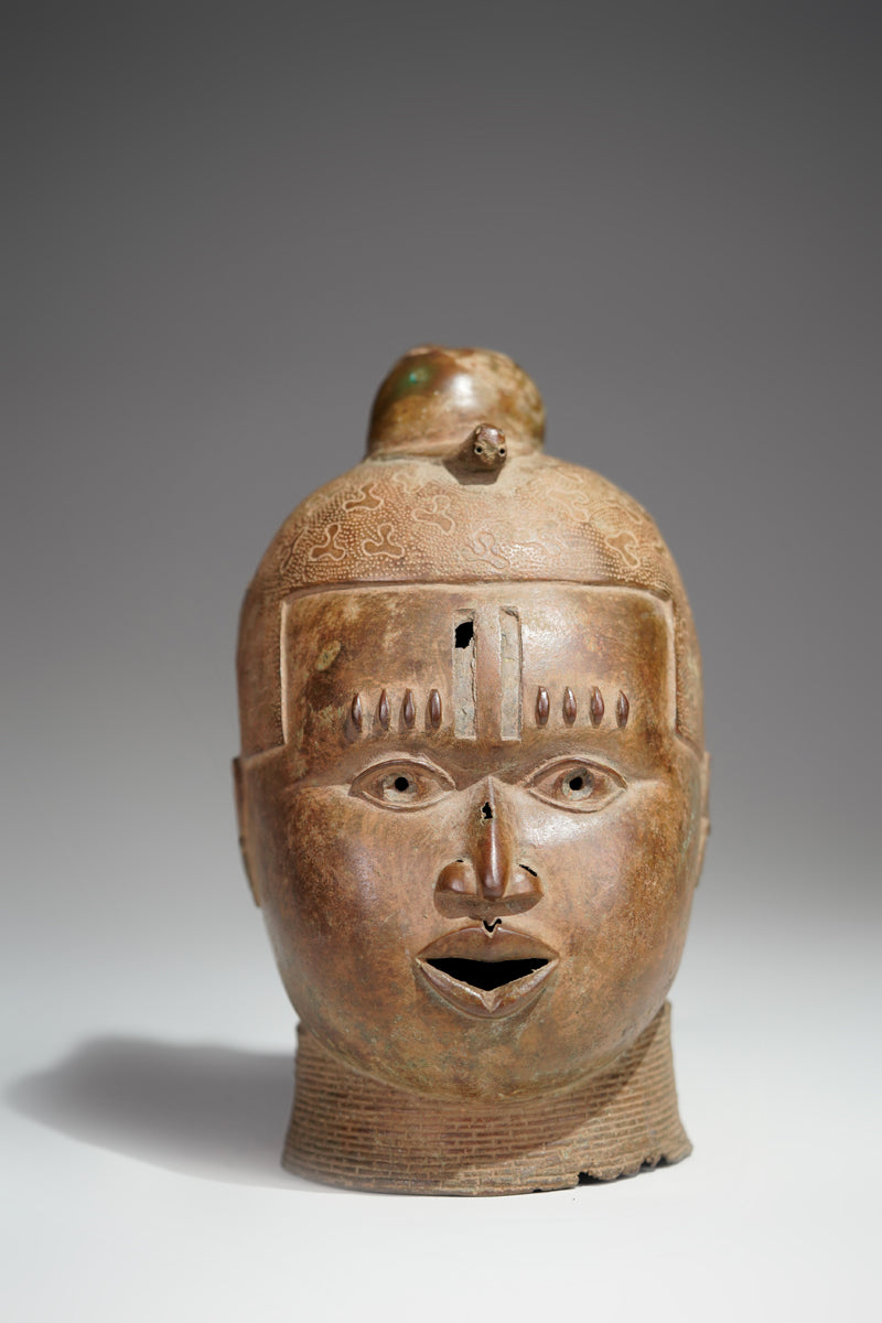 An bronze head in the style of Benin