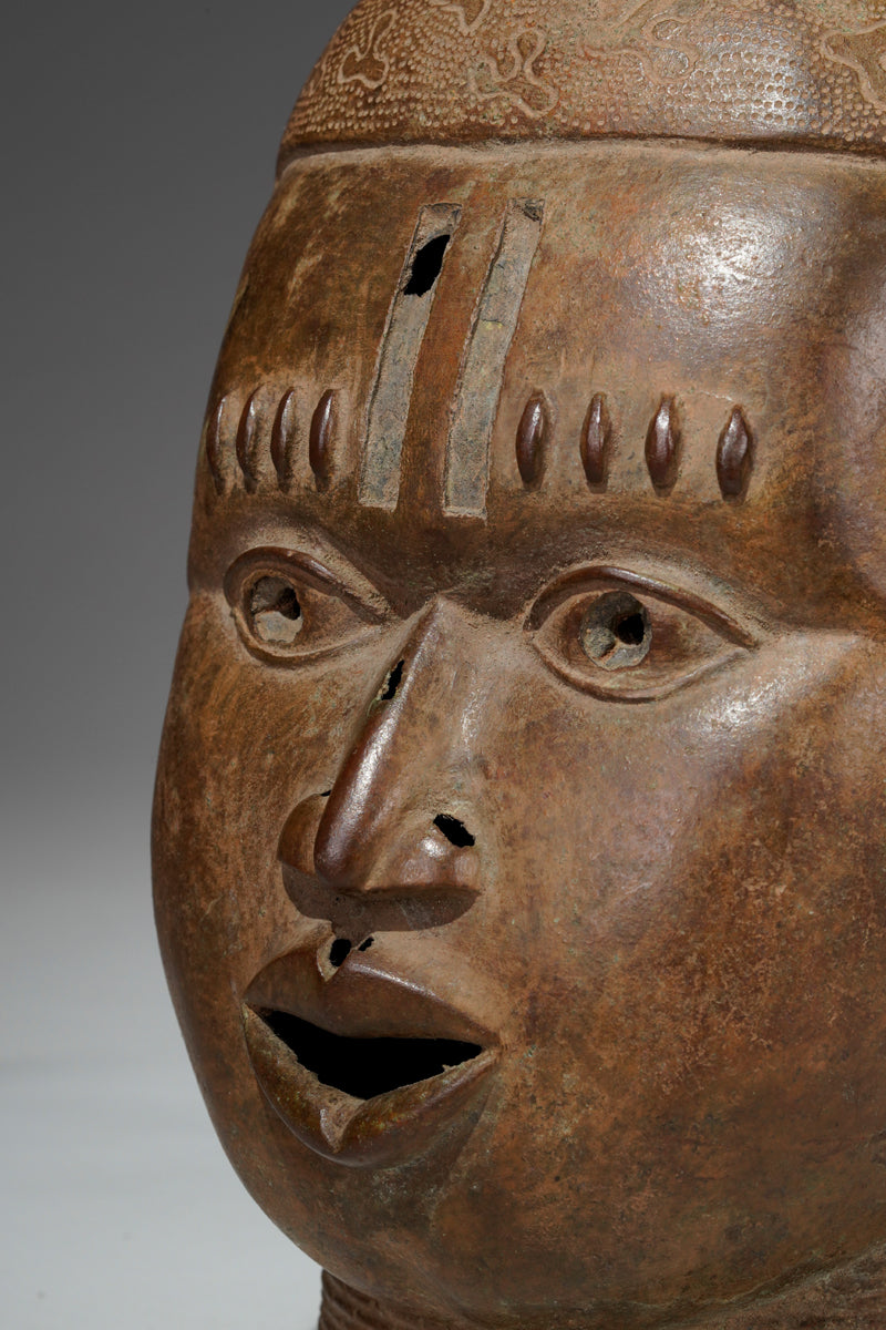 An bronze head in the style of Benin