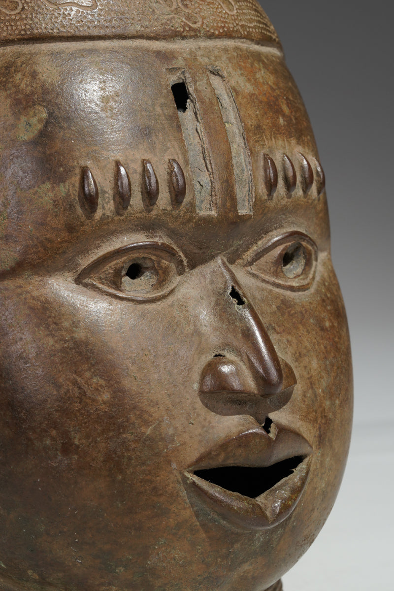 An bronze head in the style of Benin