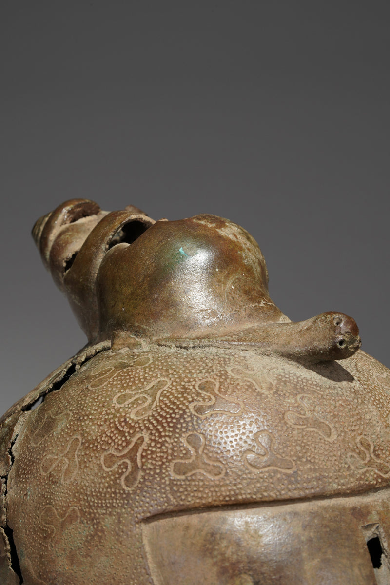 An bronze head in the style of Benin