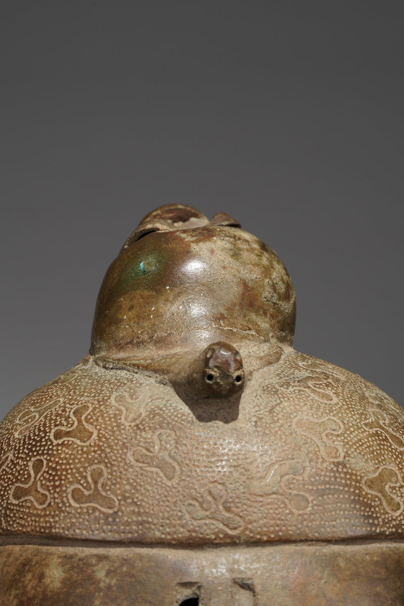 An bronze head in the style of Benin
