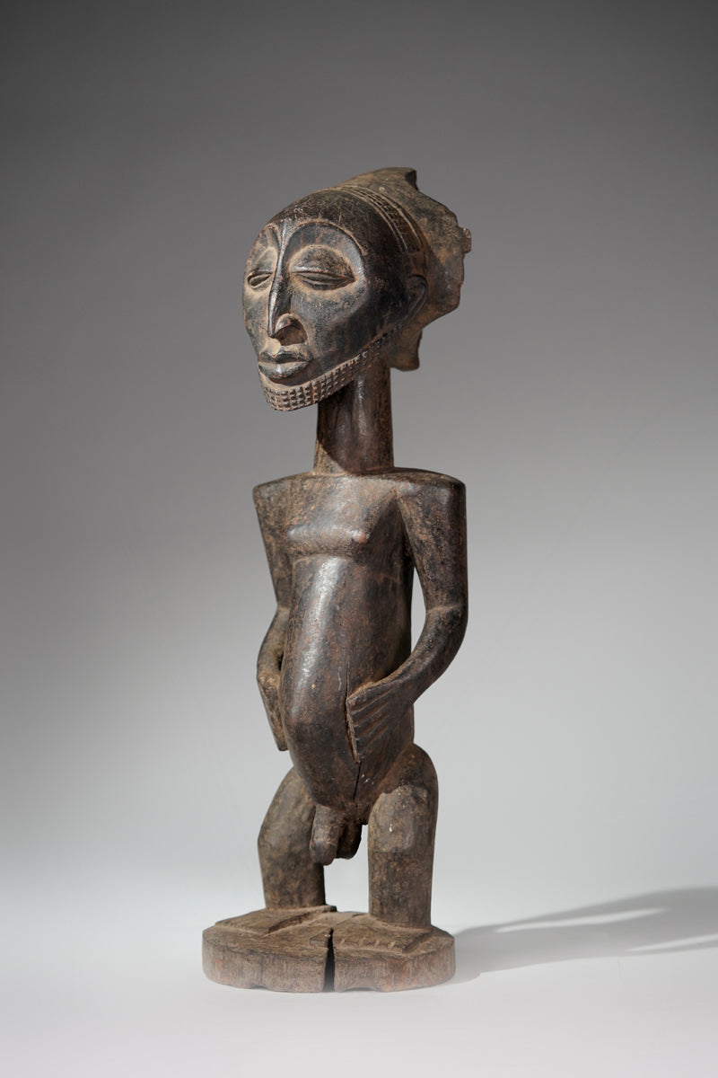 A male Hemba sculpture