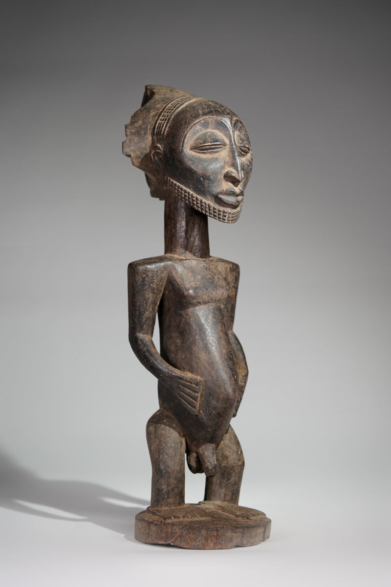 A male Hemba sculpture
