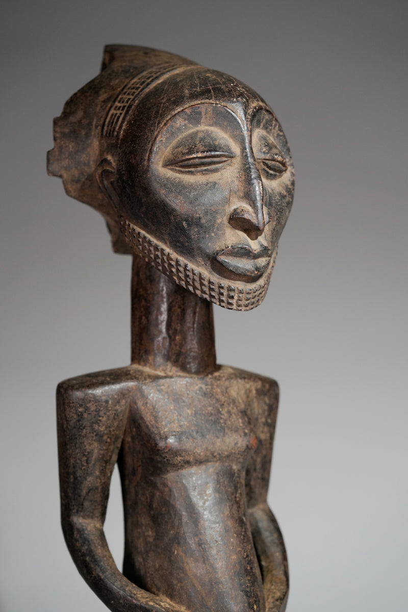 A male Hemba sculpture
