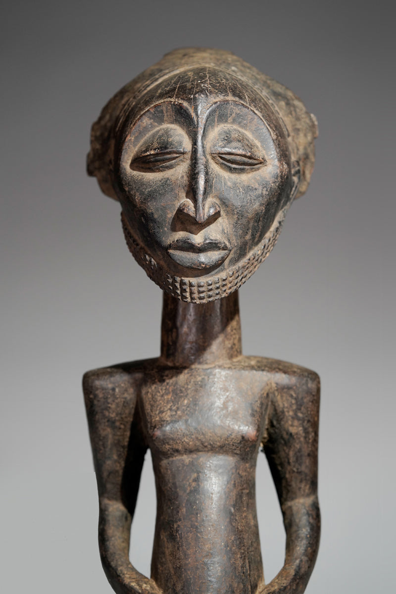 A male Hemba sculpture