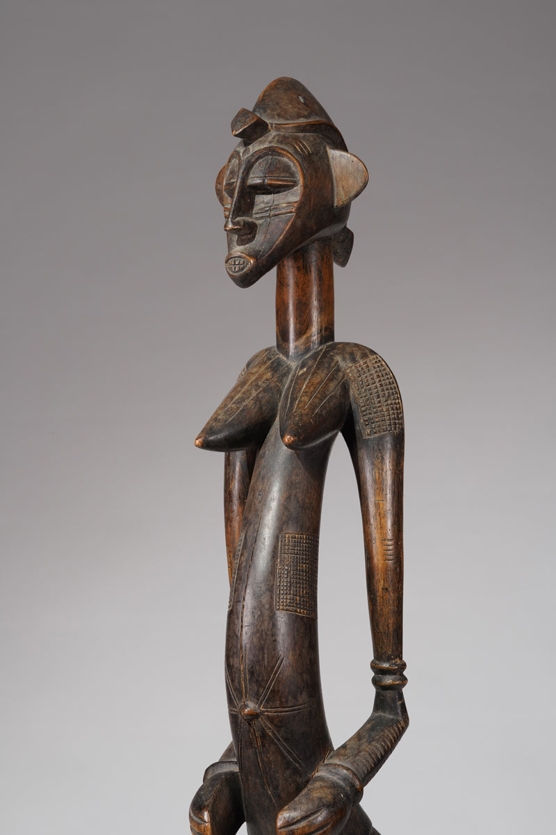 An outstanding female Senufo Déblé or guardian sculpture
